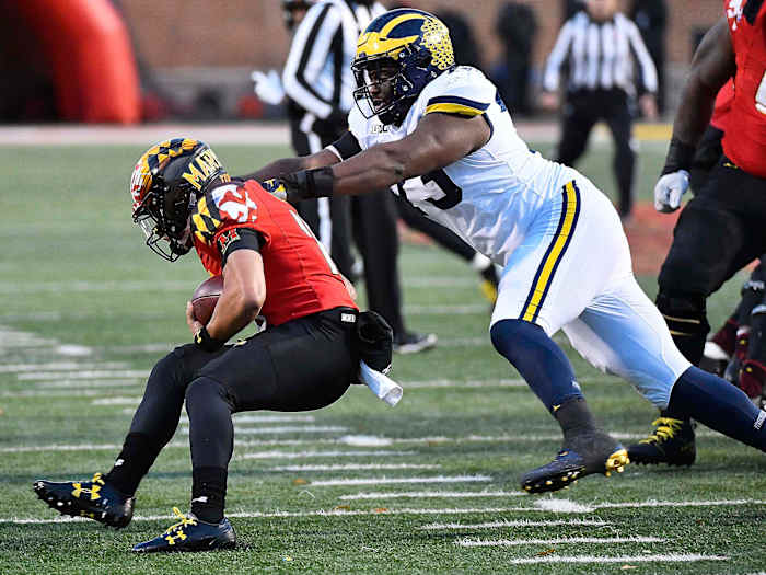 Maryland QB Ryan Brand is tackled by Michigan in 2017